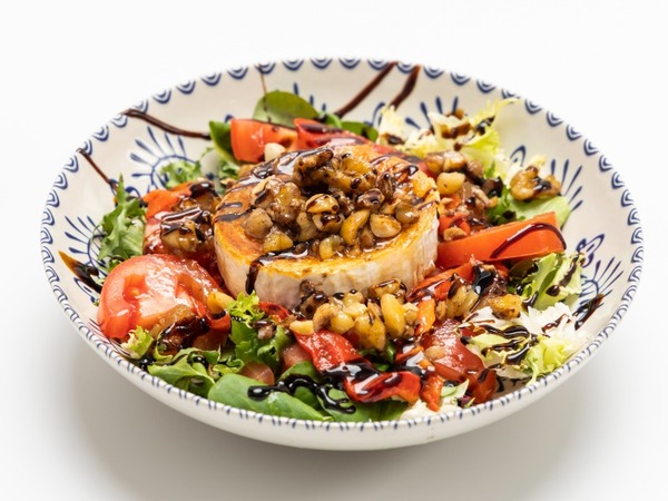 Goat cheese salad with orange vinaigrette and nuts