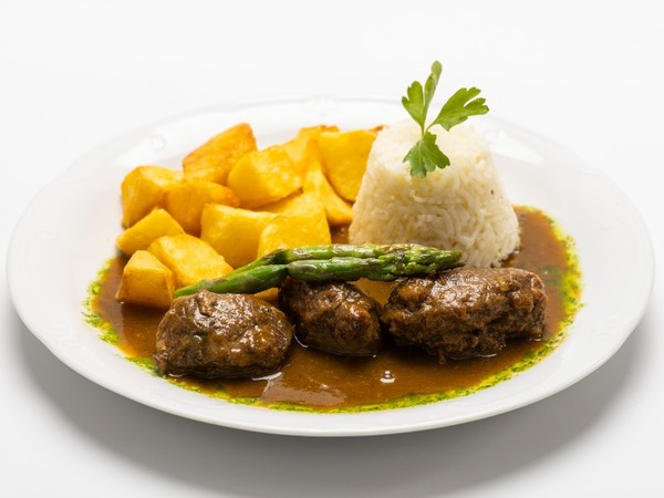 Braised Iberian pork cheek in a vegetable and port wine sauce